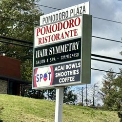 Pomodoro Plaza - Sign with list of businesses