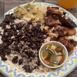 Bacon wrapped chicken with pineapple, beans, rice, maduros, boiled yucca, onion, and mojo! Yummy! Bacon wrapped chicken with pineapple, beans, rice, maduros, boiled yucca, onion, and mojo! Yummy!