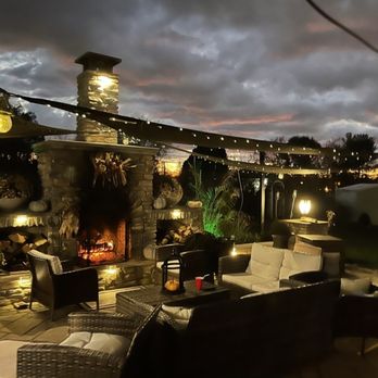 Lauro Landscaping - a patio with a fire place - Landscaping Near Me Lauro Landscaping - a patio with a fire place - Landscaping Near Me