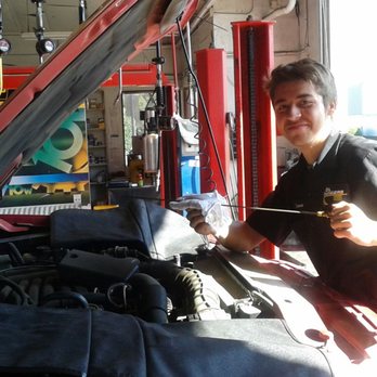 Oil Changers - Cameron checking the oil on another customers truck - Oil Change Stations Near Me - San Ramon, California Oil Changers - Cameron checking the oil on another customers truck - Oil Change Stations Near Me - San Ramon, California