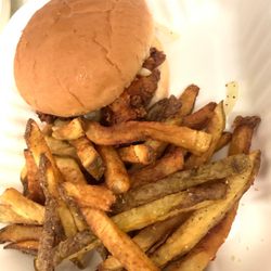 Gatsby’s Bar Raleigh - HOTSY TOTSY $14.99 Fried chicken thigh covered in hot sauce, topped with a pickle and vinegar onion chow and fries