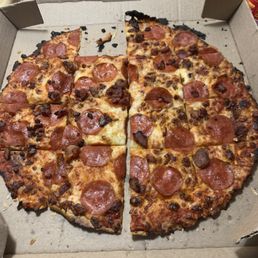 I paid premium price for this thin crust burnt pizza. Pepperonni with bacon that was like beef jerky I paid premium price for this thin crust burnt pizza. Pepperonni with bacon that was like beef jerky