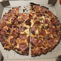 Domino's Pizza - I paid premium price for this thin crust burnt pizza. Pepperonni with bacon that was like beef jerky