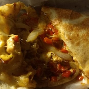 Houligan's Speedway - A peek inside of the quesadilla, red peppers, onions and cheese were added. - Chicken Wings Near Me - Daytona Beach, Florida Houligan's Speedway - A peek inside of the quesadilla, red peppers, onions and cheese were added. - Chicken Wings Near Me - Daytona Beach, Florida