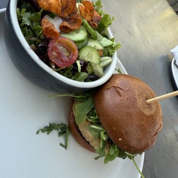 The Cloverfield - Salmon burger with salad - New American Near Me - Santa Monica, California The Cloverfield - Salmon burger with salad - New American Near Me - Santa Monica, California