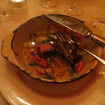 Pulcino - tenderloin with rosemary and chili oil. You can't see the potatoes on the side. - Italian Near Me - Zürich, ZH Pulcino - tenderloin with rosemary and chili oil. You can't see the potatoes on the side. - Italian Near Me - Zürich, ZH