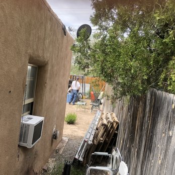 One Above Legacy - an air conditioner in a back yard - Handyman Near Me
