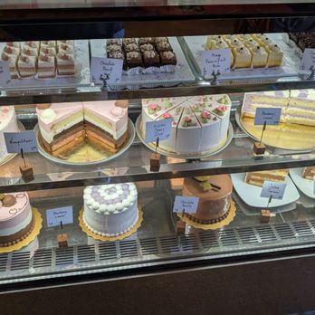 Trafiq Cafe & Bakery - Cake display with all of their cakes by the slice - Cafes Near Me - Vancouver, British Columbia