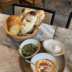 Nura - Bread basket and assortment of spreads