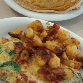 About Time Cafe - Pineapple Upside Down Pancakes and Goat Cheese, Sun-dried Tomatoes and Spinach Omelet.   Yummy. - Breakfast & Brunch Near Me - Sunrise, Florida