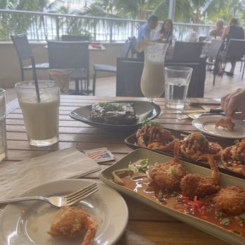 Tikis Grill & Bar - Coconut shrimp app Ahi poke sliders app Guava Glazed Baby Back Ribs app - Seafood Near Me - Honolulu, Hawaii