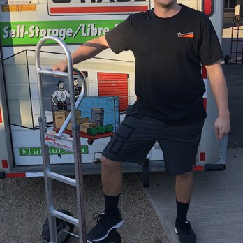 Moving In Motion - Smiling after a long day of moving. - Movers Near Me Moving In Motion - Smiling after a long day of moving. - Movers Near Me