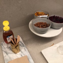 milk + honey | Culver City - Nuts, dried fruit, hot tea, and water in the lounge area