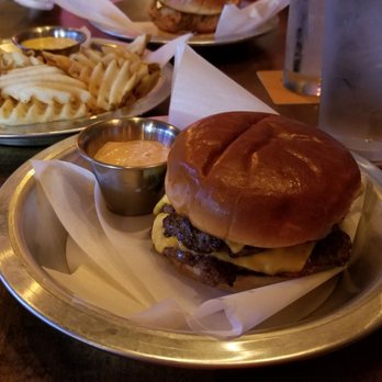 Delwood - Double cheese burger, waffle fries and chicken sandwich in the back. - Gastropubs Near Me - Cincinnati, Ohio
