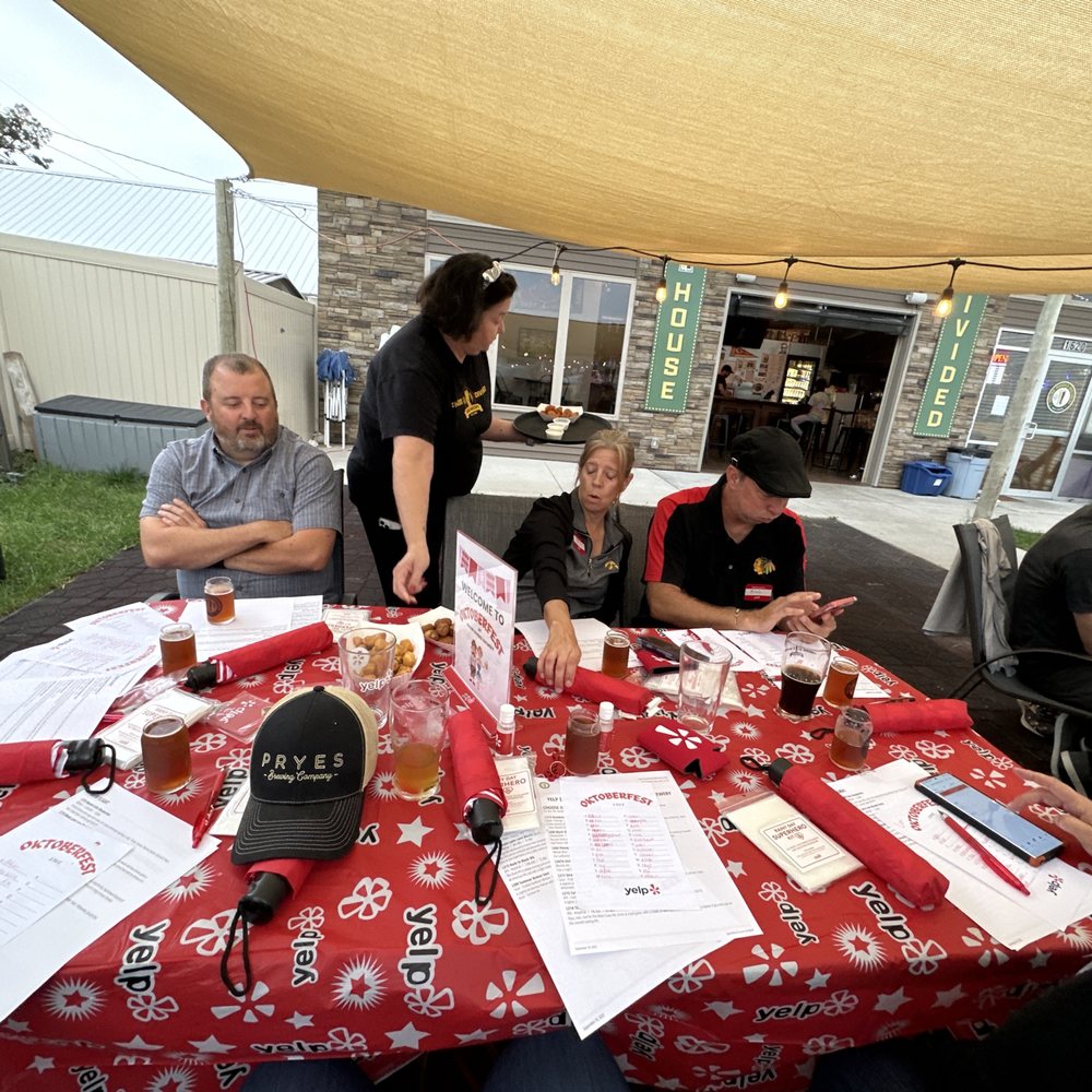 House Divided Brewery - a group of people sitting around a table - Breweries Near Me - Ely, Iowa House Divided Brewery - a group of people sitting around a table - Breweries Near Me - Ely, Iowa