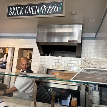 Summer Kitchen +bakeshop - Brick oven pizza prepararion - New American Near Me - Berkeley, California