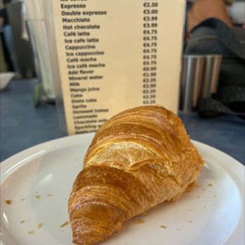 Flying With Jerome - a croissant on a plate - Breakfast & Brunch Near Me - Clearwater, Florida