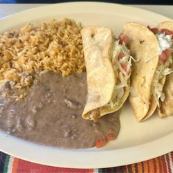Restaurant De Maria - Crispy chicken tacos with rice and refried beans.