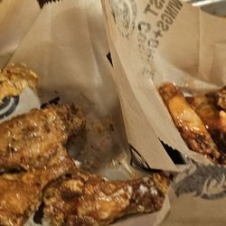 East Coast Wings + Grill - Hot honey on the right. 5/5 Cajun ranch on the left. 3.5/5