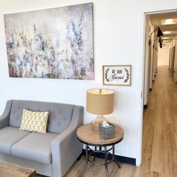 Total Wellness Dental Studio - Waiting room to clinical hallway.