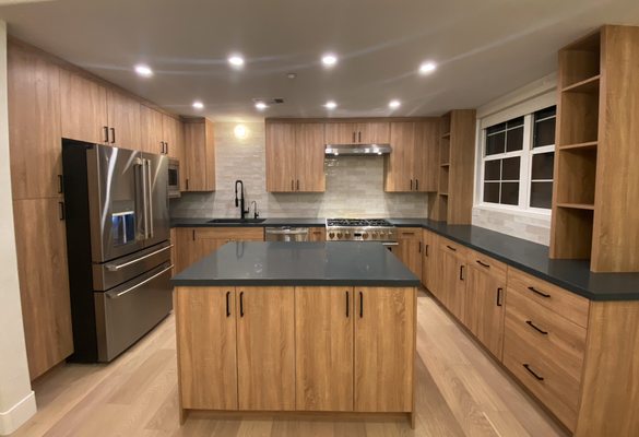 Custom Kitchen Cabinets - Residential - This kitchen underwent a full transformation to achieve a more modern aesthetic. Flooring and appliances were replaced and cabinets were tailor-made to fit client's specific needs. Under cabinet lighting was added to elevate the look. Custom Kitchen Cabinets - Residential - This kitchen underwent a full transformation to achieve a more modern aesthetic. Flooring and appliances were replaced and cabinets were tailor-made to fit client's specific needs. Under cabinet lighting was added to elevate the look.