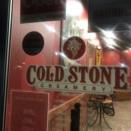 Open sign with times posted but store is closed.