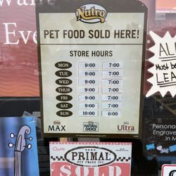Mini Pet Mart - hours of operation as of may 22 '24. and partial photo of a sign that says "all pets [dogs?] welcome on a leash!"