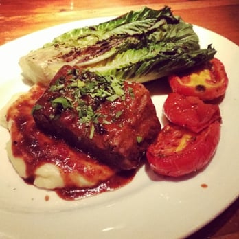 Beatrix - Slow braised short rib with grilled romaine graders, tomatoes, mashed potato, and balsamic steak sauce - New American Near Me - Chicago, Illinois Beatrix - Slow braised short rib with grilled romaine graders, tomatoes, mashed potato, and balsamic steak sauce - New American Near Me - Chicago, Illinois