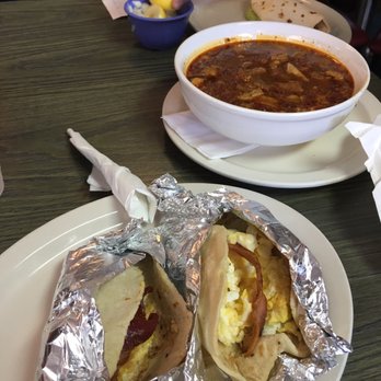 Tommy's Restaurant - Front to back: two bacon and egg tacos on corn, large bowl of menudo and barbacoa taco with guacamole - Mexican Near Me - San Antonio, Texas Tommy's Restaurant - Front to back: two bacon and egg tacos on corn, large bowl of menudo and barbacoa taco with guacamole - Mexican Near Me - San Antonio, Texas