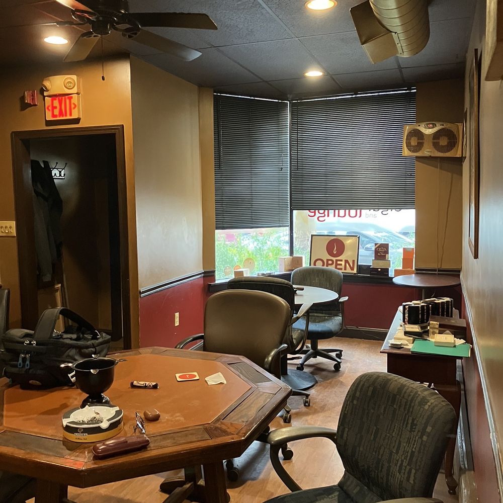 Cigar and Lounge - a cigar lounge with chairs and a table - Tobacco Shops Near Me - Watertown, Massachusetts