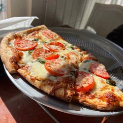 Great pizza.  Friendly atmosphere. The cheese garlic bread was also delicious.