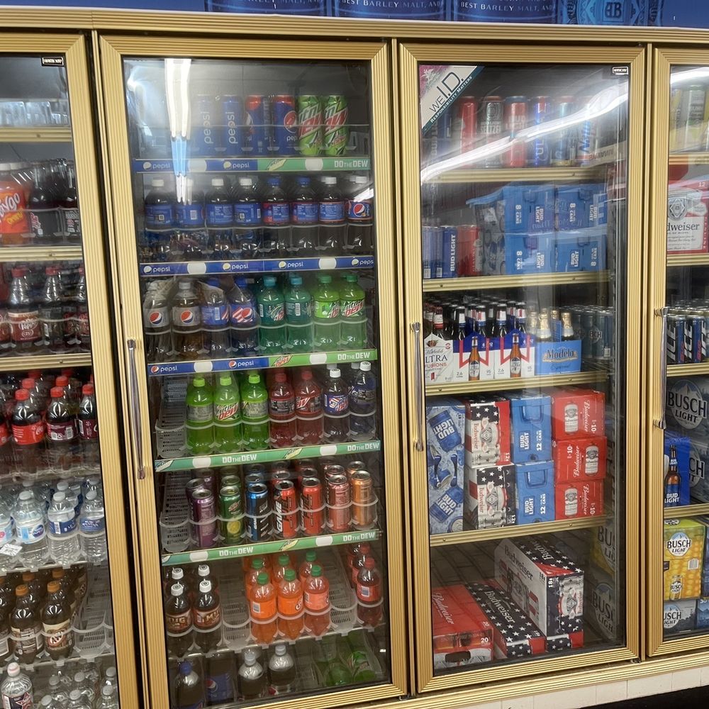 Kwick Stop - a refrigerated display of sodas and soft drinks - Convenience Stores Near Me - Newalla, Oklahoma