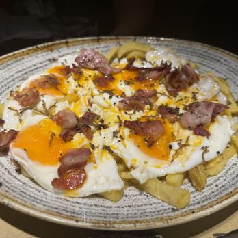 Juana la Loca - "BROKEN EGGS" WITH BLACK TRUFFLE AND IBERIC BACON - Tapas/Small Plates Near Me - Madrid, M