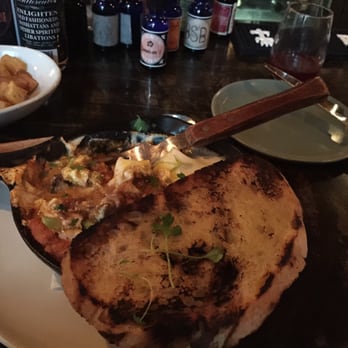 Movida - Baked eggs with braised short ribs and mushrooms and asparagus and gait cheese - Spanish Near Me - Milwaukee, Wisconsin