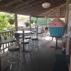 Tough Cookie Bakery - Patio seating and a giant cupcake on display