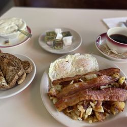 Tastee Diner - Over easy eggs, bacon, potatoes with onion, rye toast, chipped beef gravy, and coffee.
