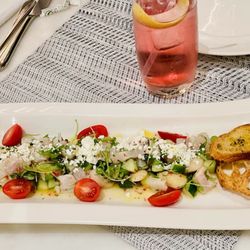 Ceviche and Tito with seltzer and cranberry