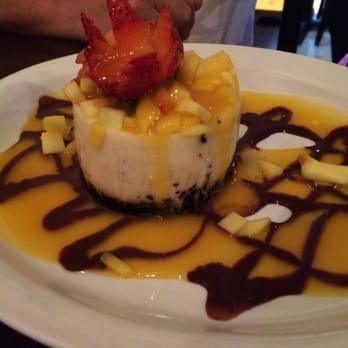 Agave Grill - House made cheesecake, tipped with mangos and a strawberry!! - Mexican Near Me - Hartford, Connecticut