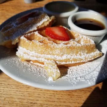 Rusty Pelican - Belgian waffle with whiskey butter and strawberries - Seafood Near Me - Tampa, Florida Rusty Pelican - Belgian waffle with whiskey butter and strawberries - Seafood Near Me - Tampa, Florida