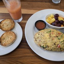 Brunch Cafe Caliente Omelet with fruit and english muffin.