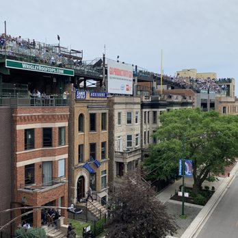 Wrigley Field - The Wrigley Rooftops. Wrigley Field, Chicago. - Stadiums & Arenas Near Me - Chicago, Illinois Wrigley Field - The Wrigley Rooftops. Wrigley Field, Chicago. - Stadiums & Arenas Near Me - Chicago, Illinois