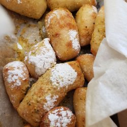 Domino's Pizza - Garlic parmesan bite dressed with powdered sugar!