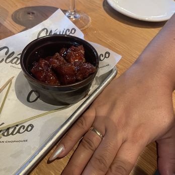 Chapter 11 Brewpub & Smokehouse - Burnt ends with hand for size comparison - Barbeque Near Me - Brandon, Florida