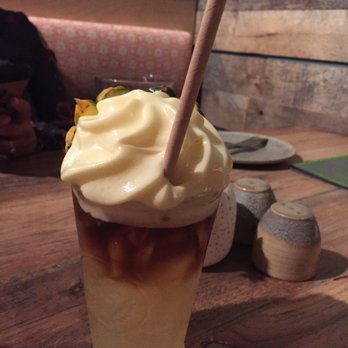 Moku Kitchen - mai tai with the lilikoi foam! whipped egg with lilikoi - Cocktail Bars Near Me - Honolulu, Hawaii