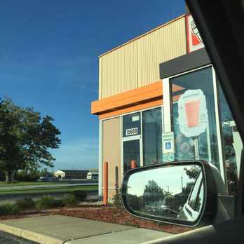 Dunkin' -  the reflection of a car's rear view mirror - Donuts Near Me - Orland Park, Illinois