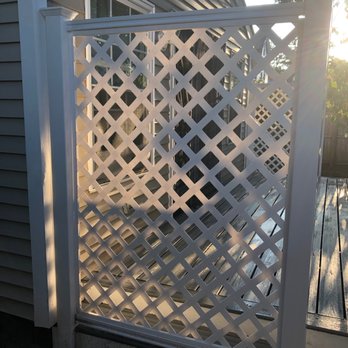 JY Construction - a gate with a lattice design - Flooring Near Me