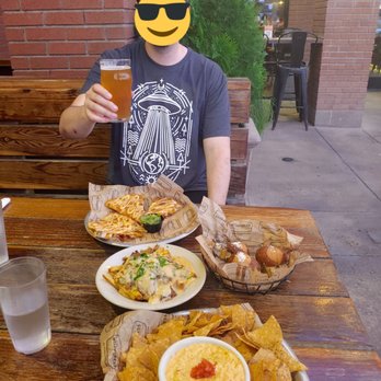 Arizona Wilderness Brewing - My fiance thoroughly enjoying his berfday din din. - Breweries Near Me - Gilbert, Arizona