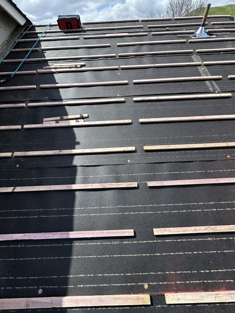 Slide of Vigil Roofing