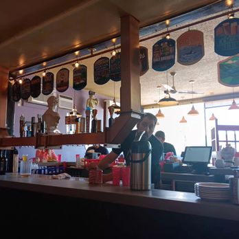 Local Myth Pizza - Kitchen area, bar and decore is fun and they had cool merch/tshirts for sale too - Pizza Near Me - Chelan, Washington Local Myth Pizza - Kitchen area, bar and decore is fun and they had cool merch/tshirts for sale too - Pizza Near Me - Chelan, Washington