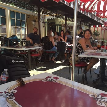Carnation Cafe - Outdoor seating and people watching the parade - American Near Me - Anaheim, California